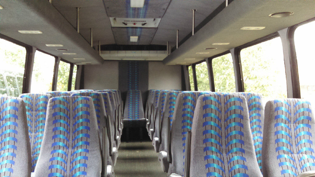 A bus with many seats in it