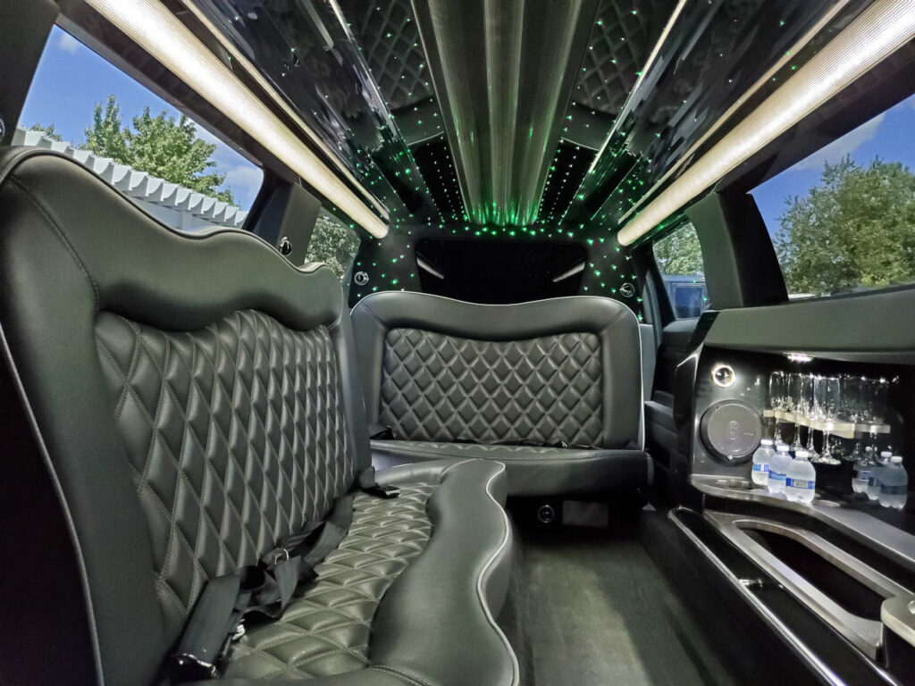 A view of the back seats in a limo.