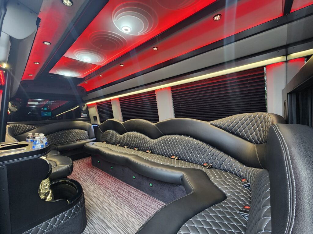 Luxury limo interior with red ambient lighting.