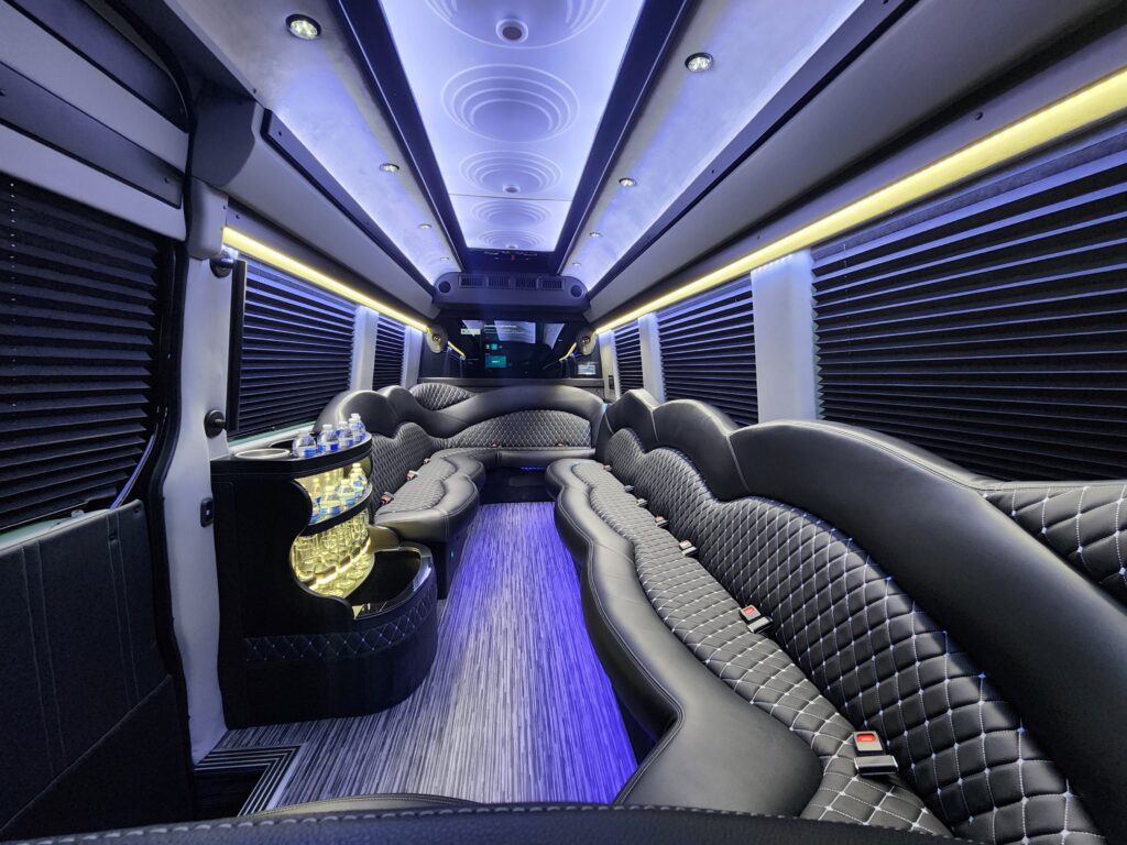 Luxury limousine interior with ambient lighting.