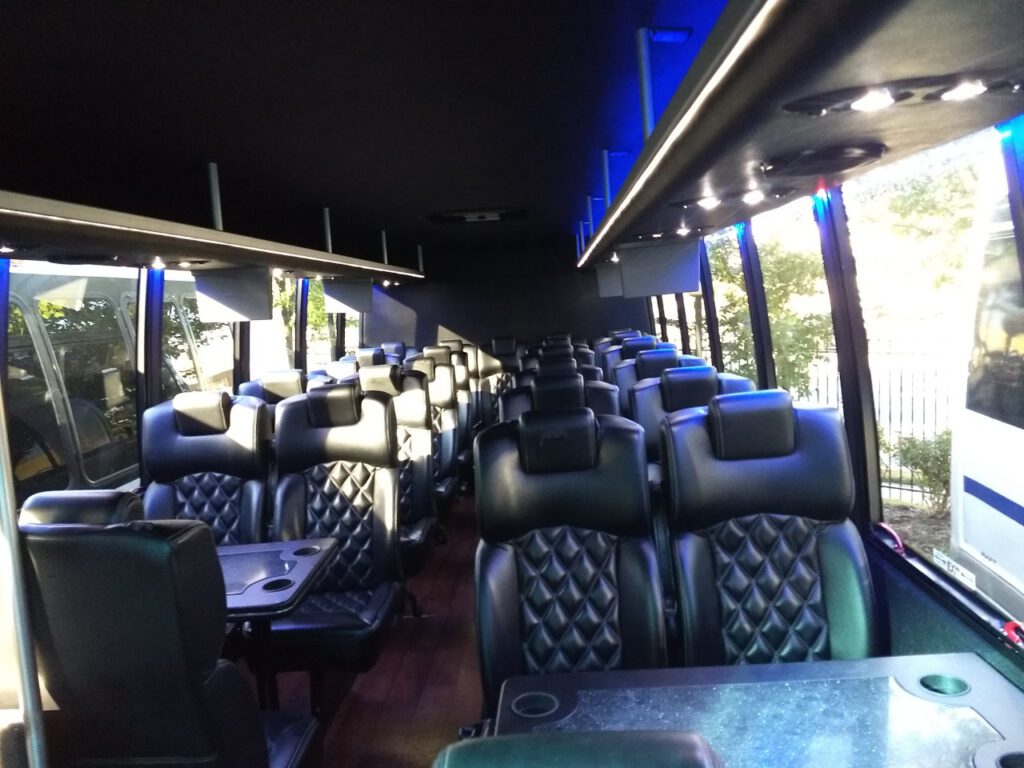 Luxury bus interior with leather seats.