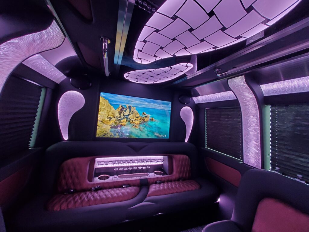 Luxury vehicle interior with ambient lighting.