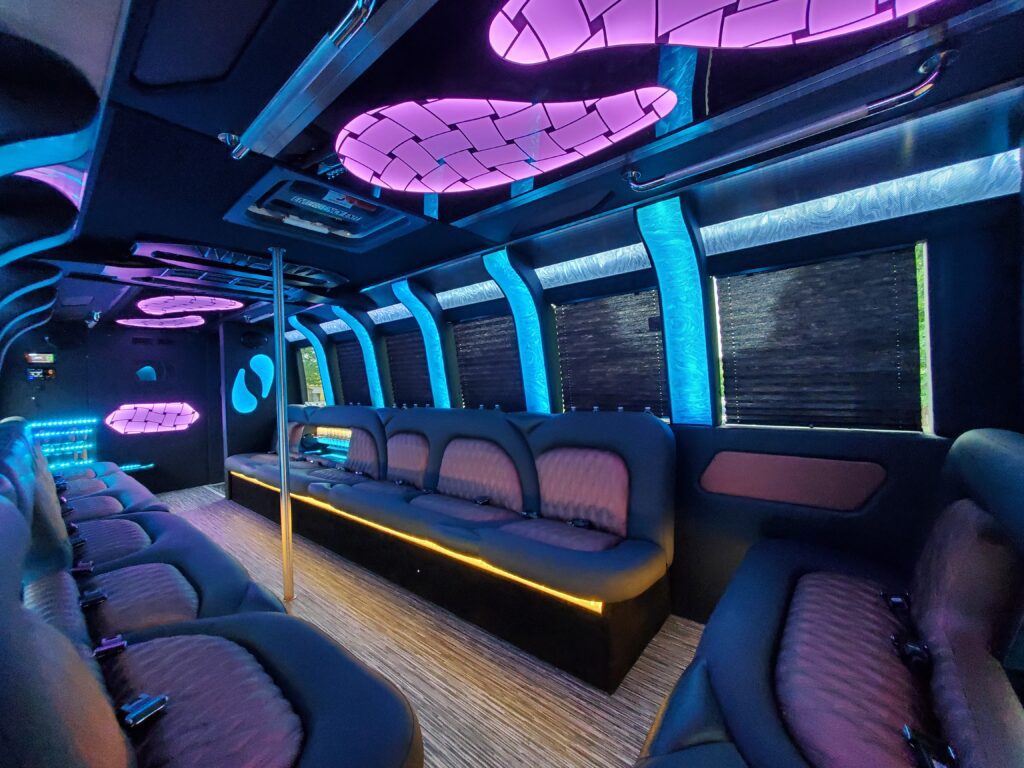 Luxurious party bus interior with neon lighting.