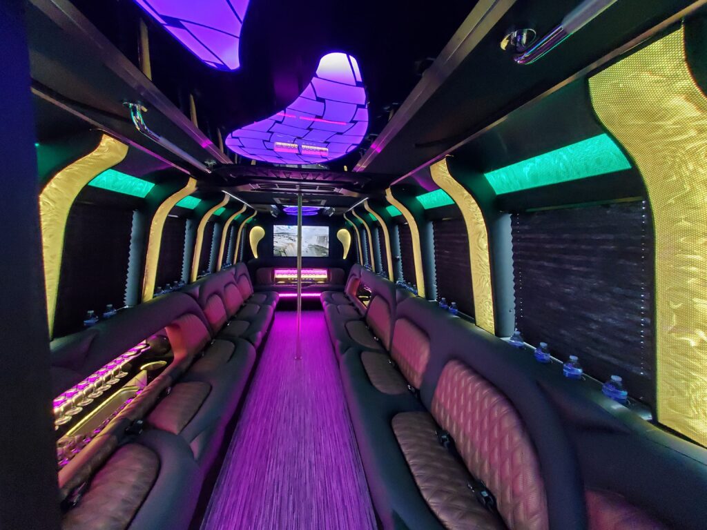 Luxurious party bus interior with colorful lighting.