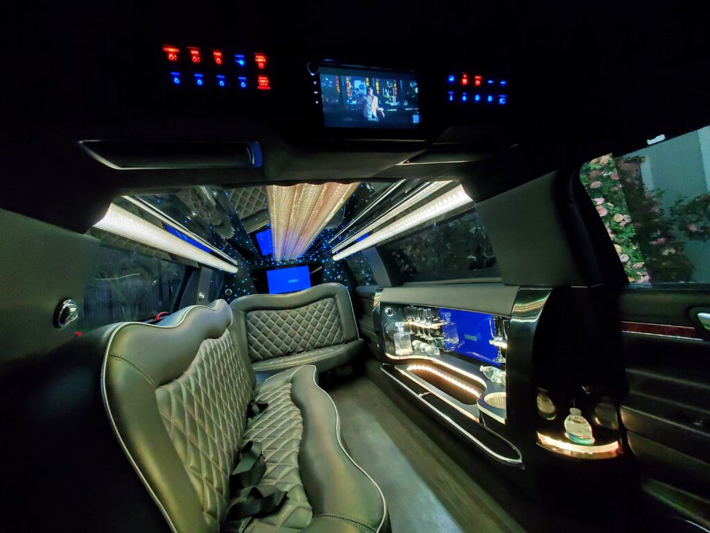 Luxury limousine interior with ambient lighting.