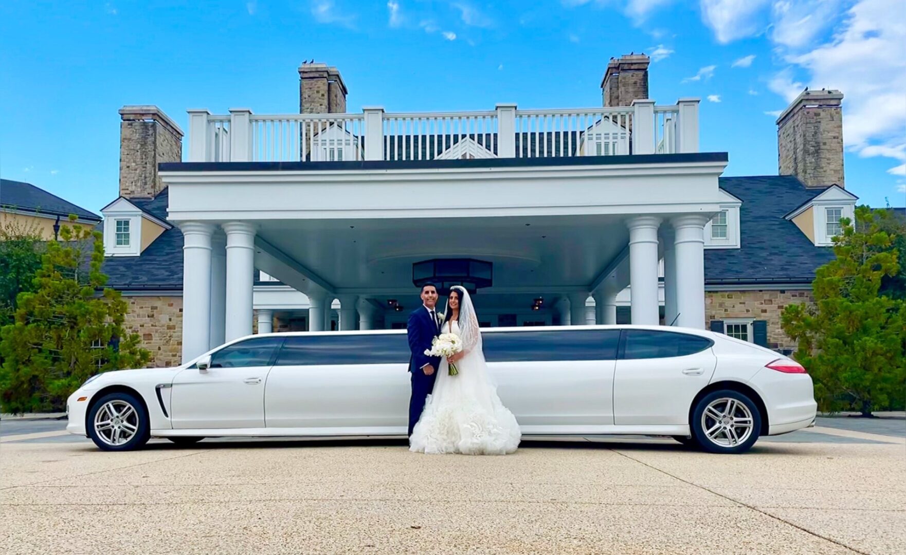 Bride and groom with white stretch limo. Bride and groom with white stretch limo.
