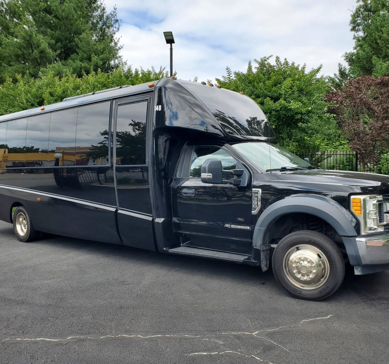 Black luxury bus parked on asphalt road. Black luxury bus parked on asphalt road.