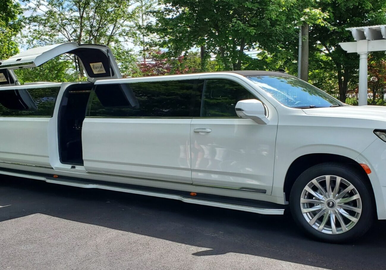 White stretch limousine with open gullwing doors. White stretch limousine with open gullwing doors.